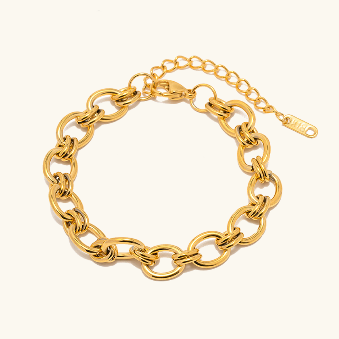 Johanna – Thin gold bracelet with charm details.