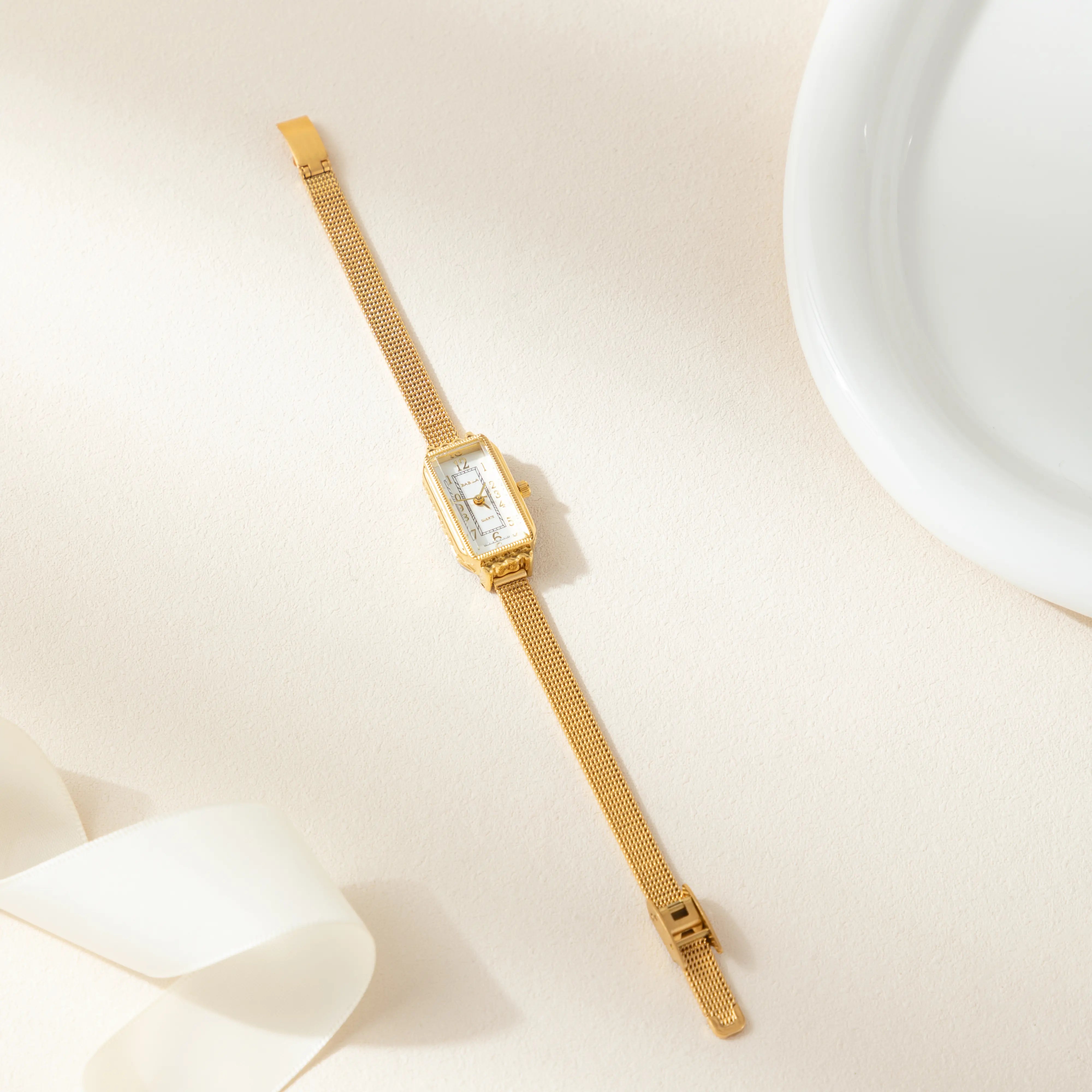 Teoresa – Gold Watch with Rectangular Dial.