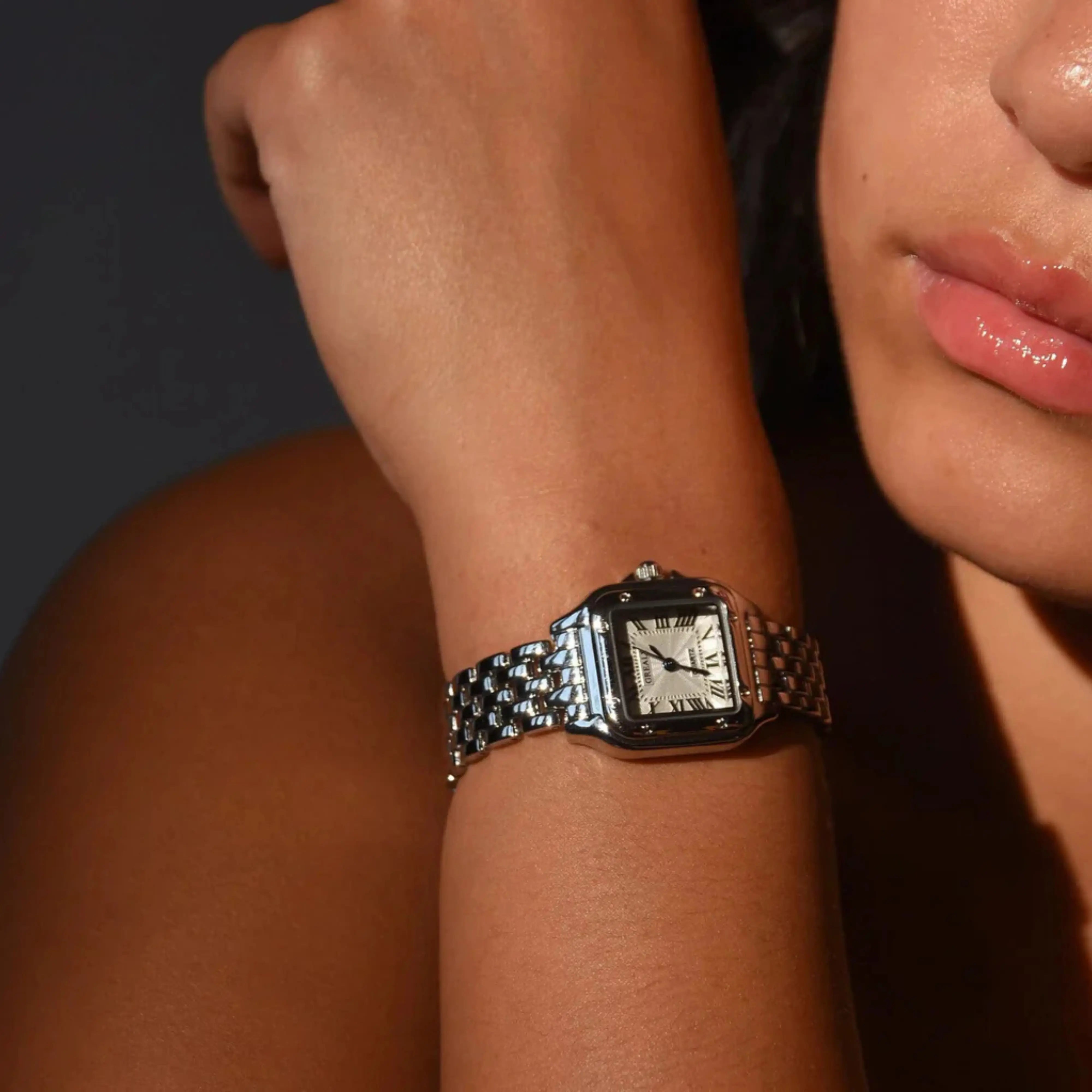 Leonie – Gold watch with square case.