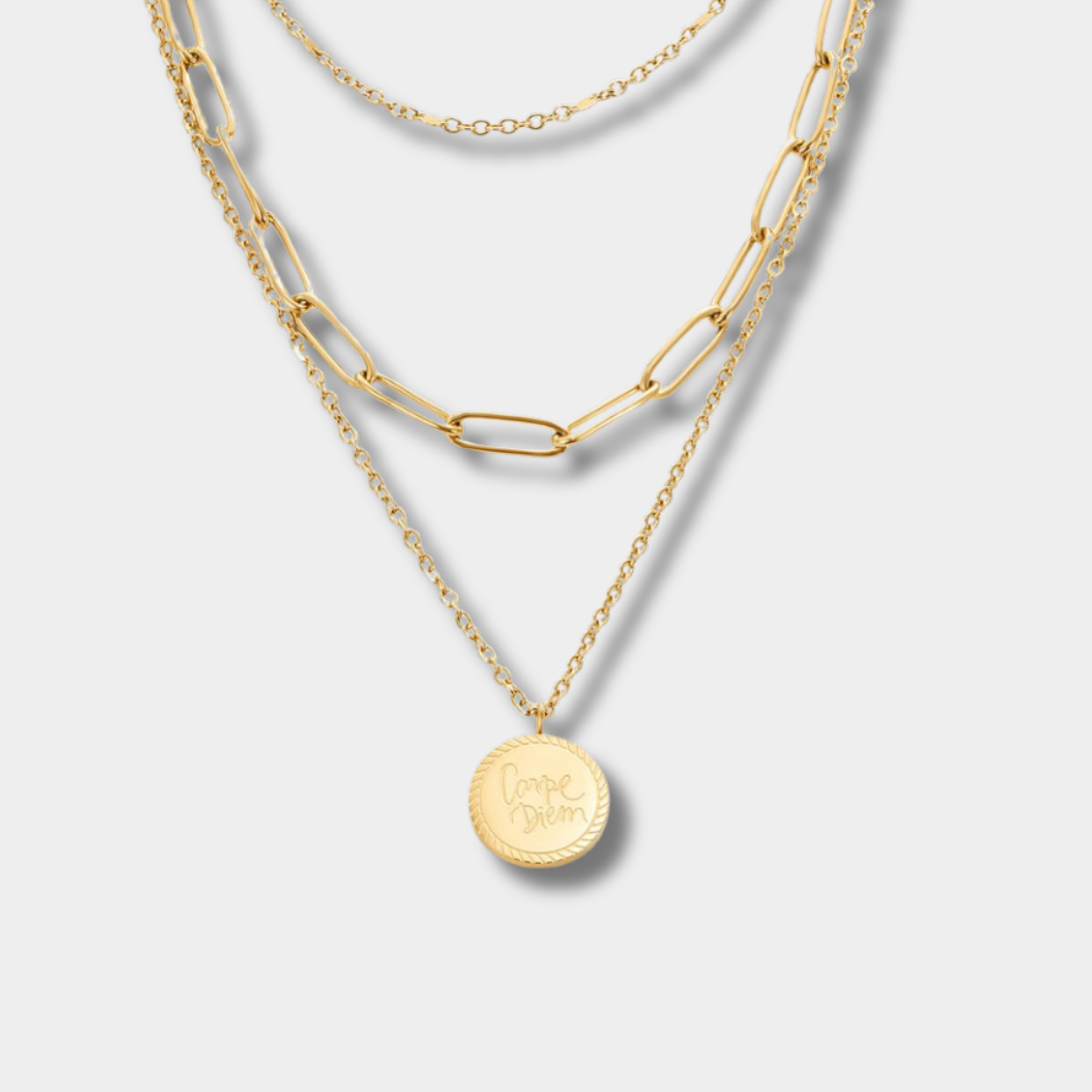 Lea – Multiple levels of necklace in soft gold with elegant lines.