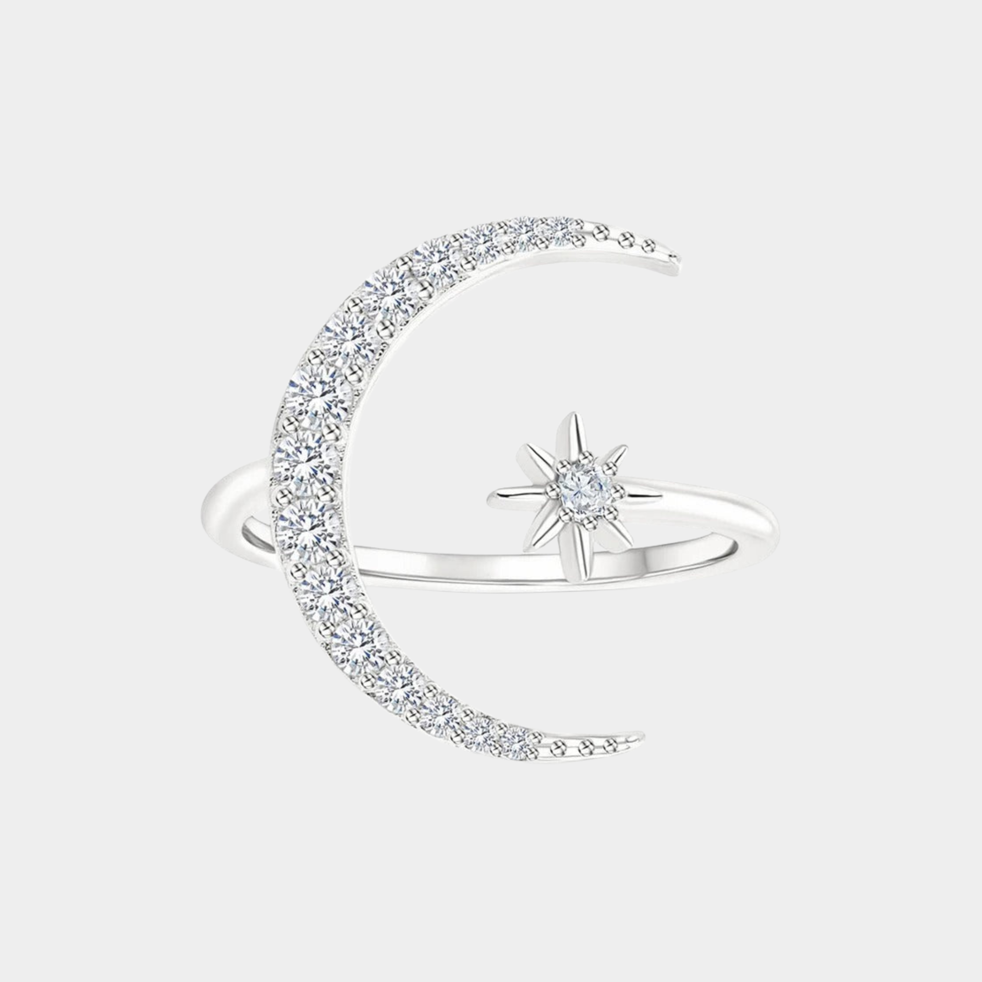 Silver ring with moon and star design