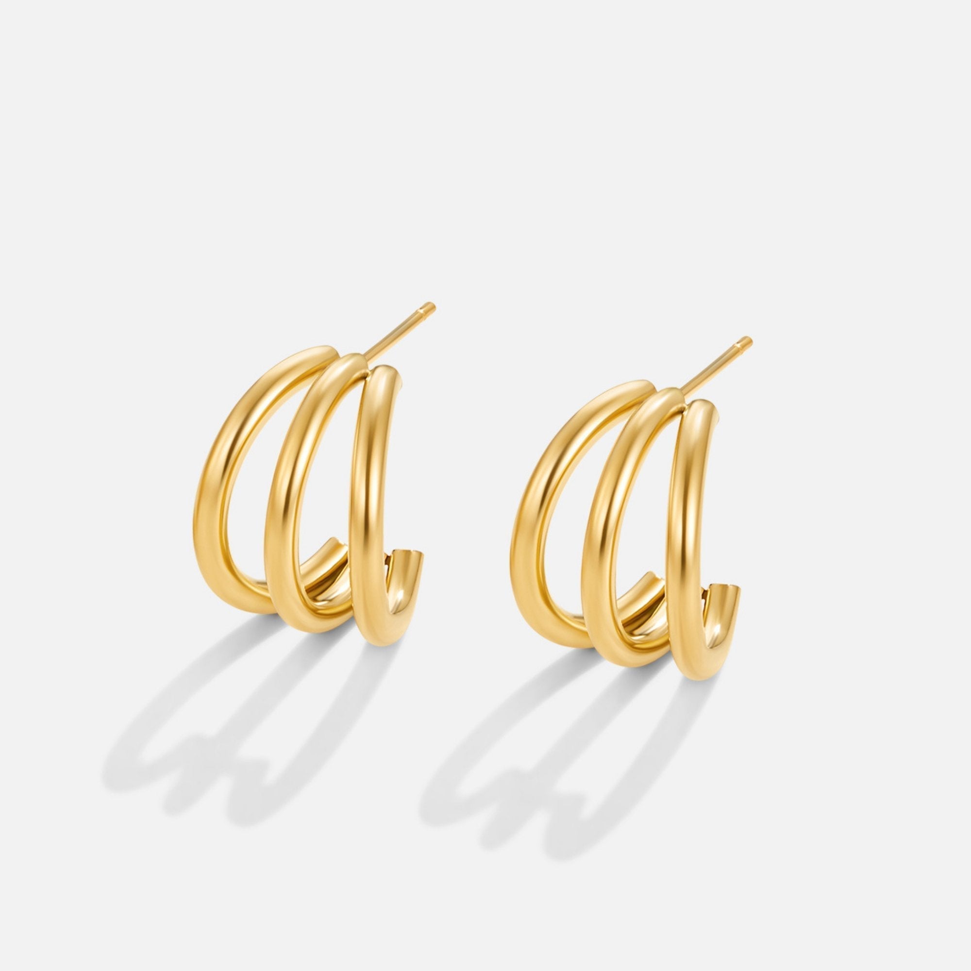 Eleni – Mini circular gold earrings with texture.