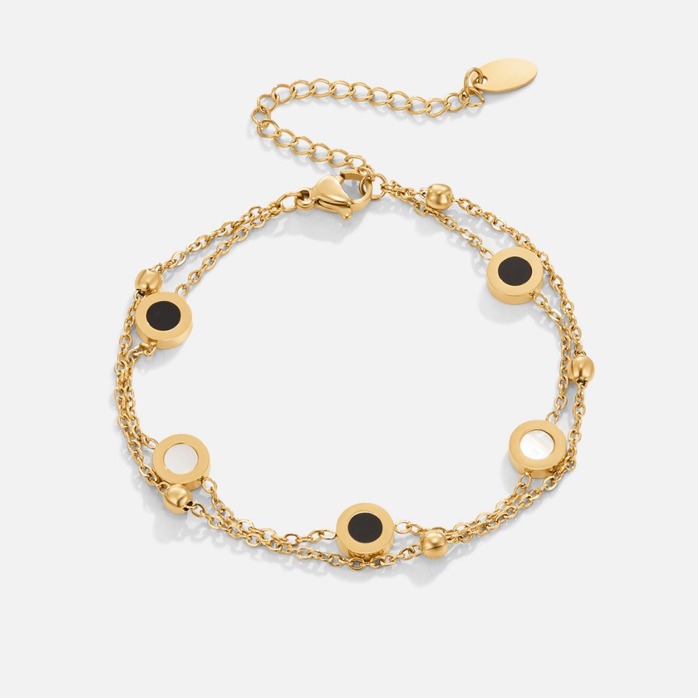 Carla – Gold bracelet with soft round contrasting elements.