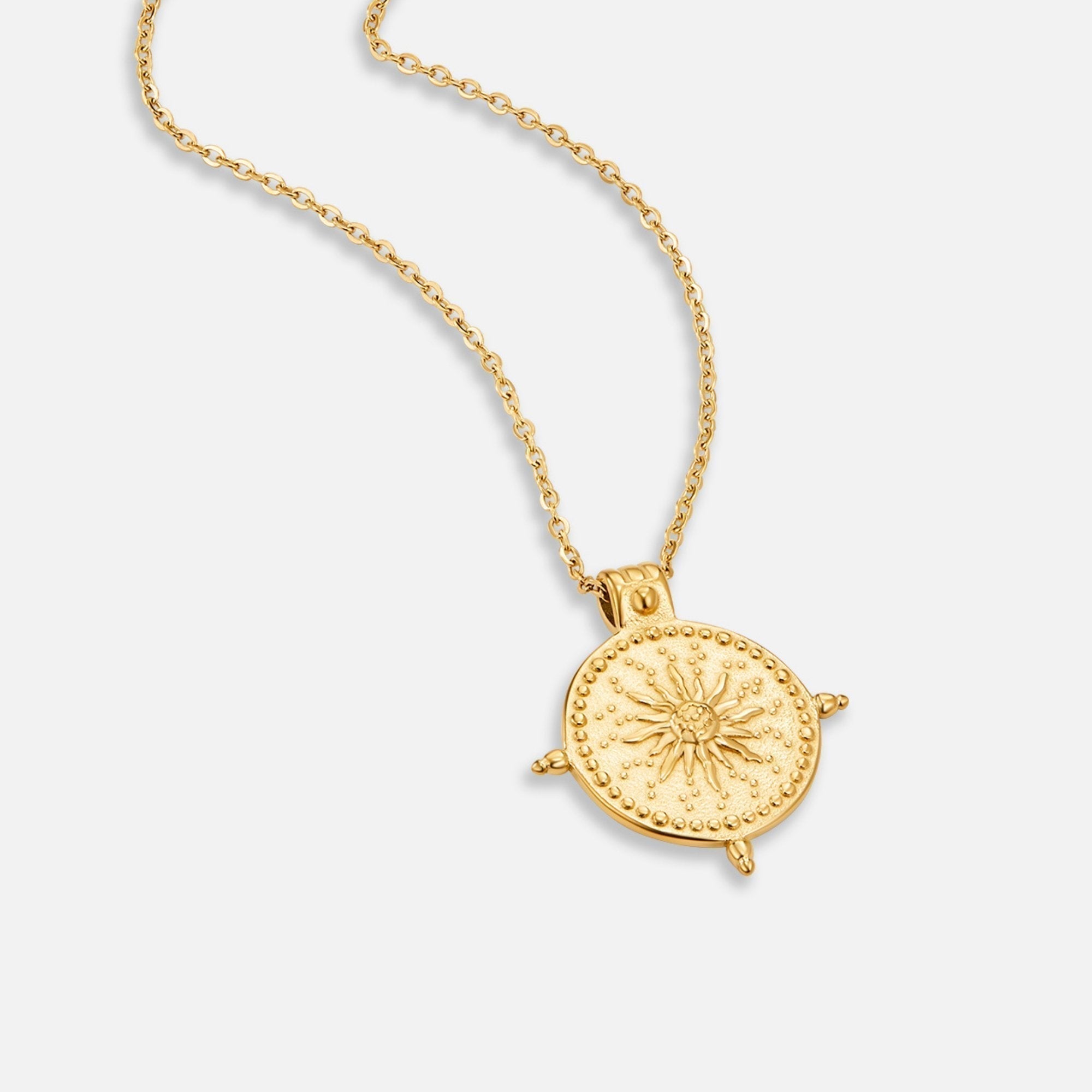 Anna – Geometric gold necklace with texture.